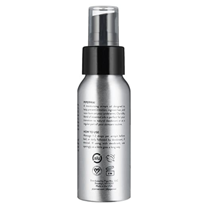 PiperWais Underarm Oil comes in a silver bottle with a black cap, featuring text and symbols. It proudly displays cruelty-free and vegan logos. This natural deodorant is infused with essential oils for freshness thats gentle on both the earth and your underarms.