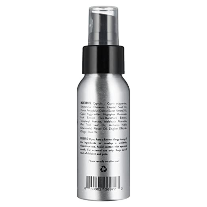 The PiperWai Underarm Oil comes in a silver spray bottle with a black cap. It features ingredients and instructions in fine print, prominently displays a recycling symbol at the bottom center, and includes barcodes. Ideal for natural deodorant enthusiasts, it details its essential oil blend.