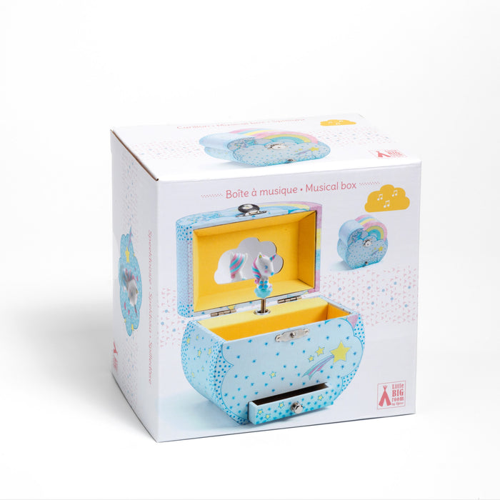 The DJECO Unicorn Dreams Musical Treasure Box is a blue, cloud-shaped music box with star patterns. It opens to reveal a unicorn figurine and features colorful illustrations and bilingual text in French and English on its packaging.