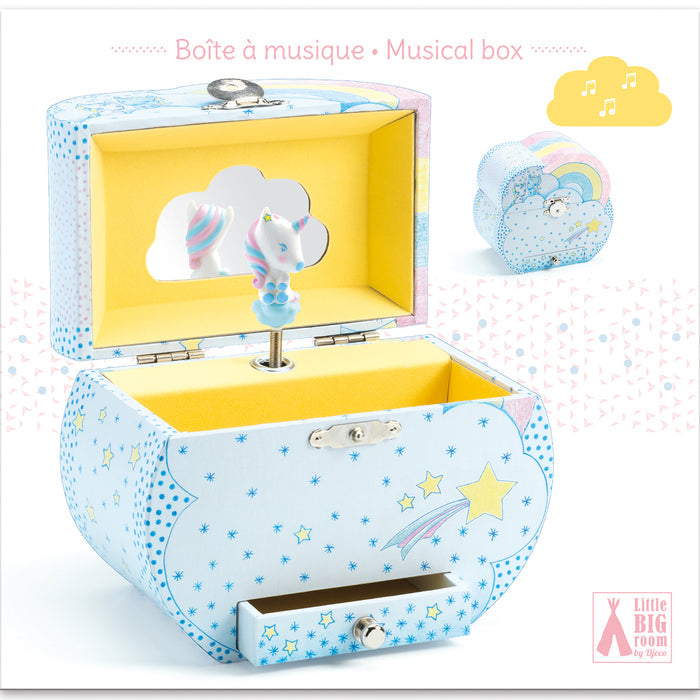 The DJECO Unicorn Dreams Musical Treasure Box is a pastel cloud-shaped jewelry music box with a rotating unicorn and a starry exterior, featuring shooting stars. An interior mirror reflects the whimsical unicorn, and an inset image displays the box when closed.