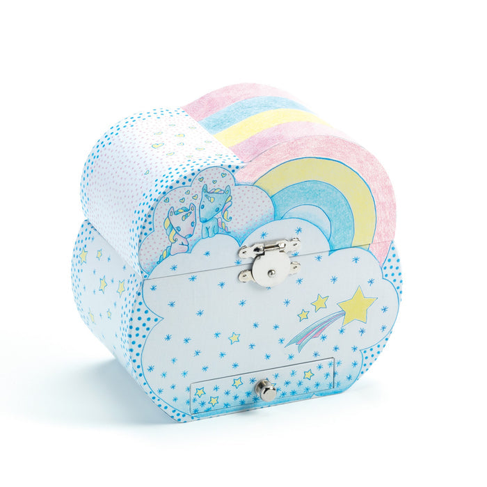 The DJECO Unicorn Dreams Musical Treasure Box is a whimsical, cloud-shaped storage box with a latch. It showcases colorful unicorn, rainbow, and shooting star designs against blue skies and white clouds, perfectly combining creativity and function like a unicorn music box.