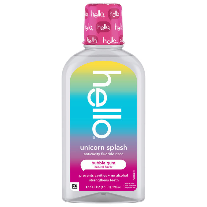 A bottle of hello Unicorn Splash Kids Mouthwash with Fluoride, alcohol-free and in bubble gum flavor, has a pink cap and rainbow label. It helps prevent cavities and strengthens teeth for happy smiles.