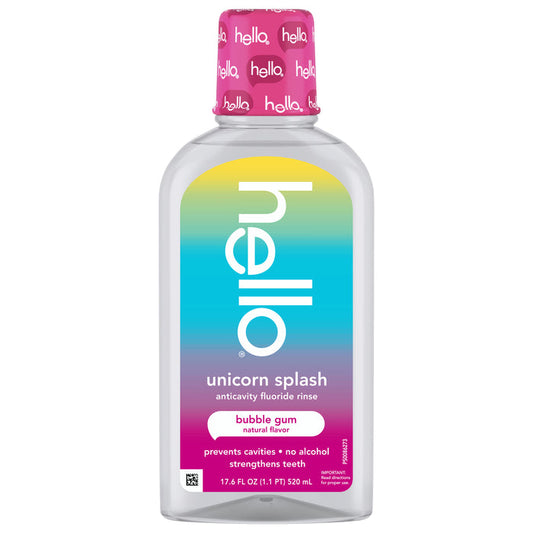 A bottle of hello Unicorn Splash Kids Mouthwash with Fluoride, alcohol-free and in bubble gum flavor, has a pink cap and rainbow label. It helps prevent cavities and strengthens teeth for happy smiles.