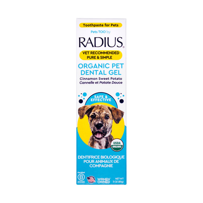 A box of Radius USDA Organic Canine Toothpaste with a dog image, cinnamon sweet potato flavor, English and French text, vet recommended, and USDA Organic certified.