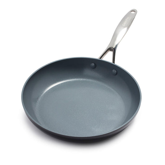 The GreenPan Valencia Pro Ceramic Nonstick Fry Pan, crafted from hard anodized aluminum, features a shiny silver handle angled to the right. Its dark gray coating ensures even cooking on a white surface and is PFAS-free for safe culinary adventures.