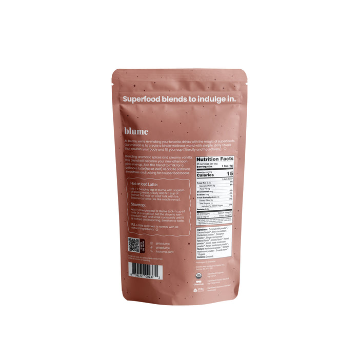 Back view of a pink stand-up pouch from blume displaying the product name Vanilla Chai Blend. The package reads Superfood blends to indulge in, with aromatic spices and creamy vanilla. Also visible are preparation instructions, a QR code, social media icons, and a nutrition facts label.