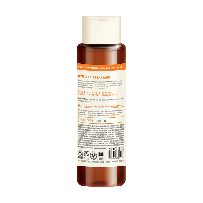 The Vegan Collagen & Fruit Enzymes Strengthening Shampoo by Soapbox comes in a brown and white plastic bottle, enriched with a vitamin complex. It reduces breakage, is vegan, color safe, sulfate-free, and includes usage instructions and certifications at the bottom.