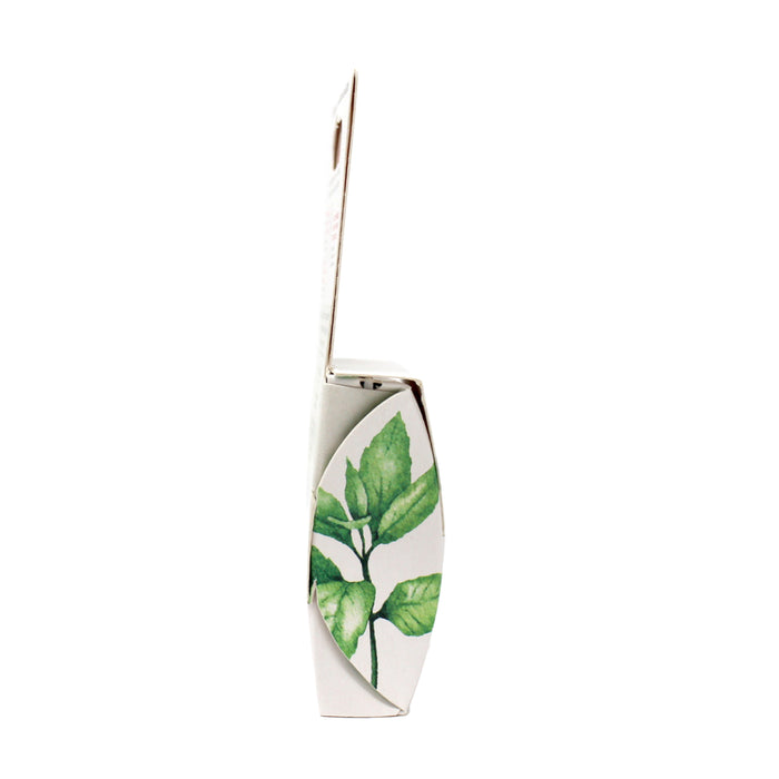A side view of the Radius Vegan Floss box, featuring a green plant illustration on its white, plastic-free packaging, which is slightly open at the top.