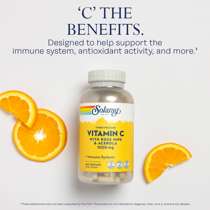 A bottle of Solaray Vitamin C with Rose Hips and Acerola is surrounded by orange slices on a white background. The text above reads, "C the Benefits," promoting immune support and antioxidant activity.