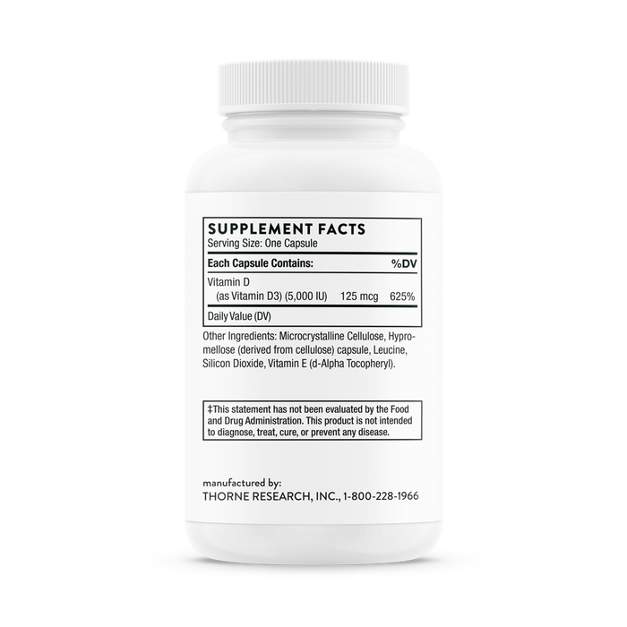 The Thorne Vitamin D-5000 supplement, in a white bottle labeled with nutrition facts, provides 125mcg (625% DV) of Vitamin D3 per capsule for immune function. It also contains cellulose, leucine, silicon dioxide, and Vitamin E. Manufactured by Thorne Research, Inc.