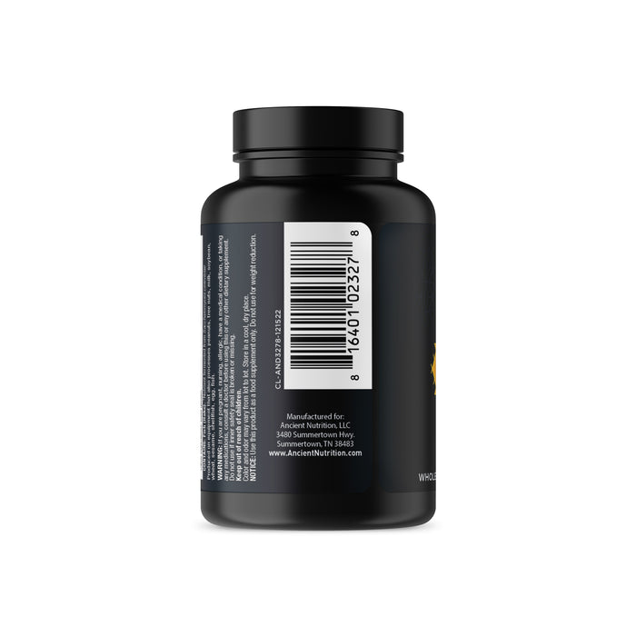 A tightly sealed black bottle labeled with a barcode holds Ancient Nutrients - Vitamin D from Ancient Nutrition, supporting immune function. The white label features small text about the manufacturer, American Nutrition LLC, located in Summerton, South Carolina.