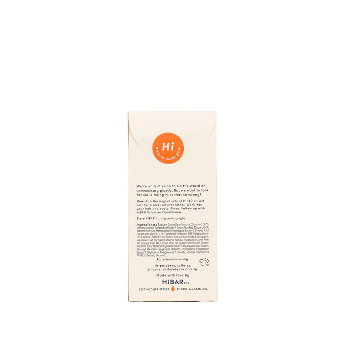 The image displays the back of a HiBAR Volumize Shampoo box. A white background features an orange circle with Hi. The text emphasizes HiBARs environmental mission and describes this shampoo bar as a solution for thin hair, including usage instructions and contact information.