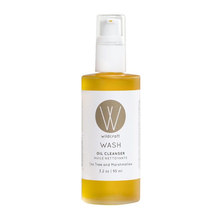 The Wildcraft Wash Oil Cleanser, infused with botanical oils, features a circular logo with a W and the text Tea Tree and Marshmallow. This 3.2 oz (95 ml) product includes a convenient pump dispenser.
