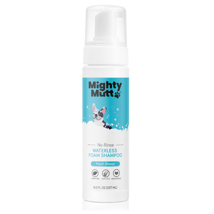 The Mighty Mutt Waterless Foam Pet Shampoo, in an 8 fl oz bottle, features a cartoon dog with bubbles on the label. It offers tearless, antistatic, and anti-itch benefits in a Fresh Breeze scent for pets deodorizing grooming needs.