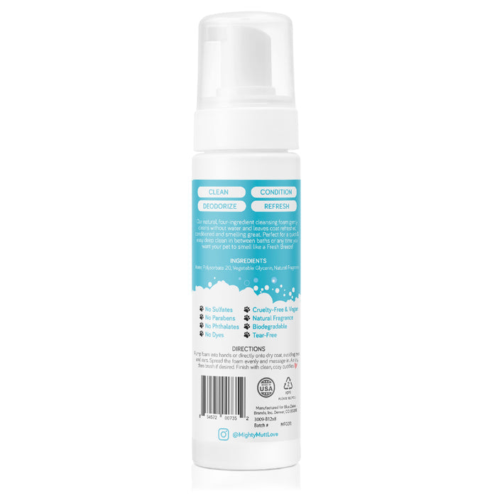 The Mighty Mutt Waterless Foam Pet Shampoo comes in a white bottle with a pump dispenser and blue and white labels, highlighting its sulfate-free, paraben-free, cruelty-free anti-itch deodorizing formula. The all-natural dry shampoo foam features instructions and the brand logo at the bottom.