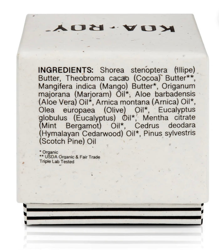 A white Wellness Cube by KOA + ROY displays ingredients like Illipe Butter, Cocoa Butter, Mango Butter, Aloe Vera, Arnica Oil, and Eucalyptus Oil. It features labels Organic, USDA Organic & Fair Trade, and Triple Lab Tested, perfect for all-natural skincare or aromatherapy.
