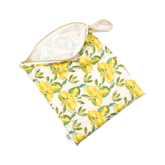 The Marleys Monsters Wet Bag is a zippered bag with a handle, designed in a lively lemons print with leaves on a light background. Its perfect for cloth diapering, and its partially open design highlights its spacious interior.