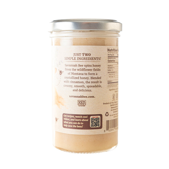 The glass jar from Savannah Bee Company is filled with Whipped Honey with Cinnamon, featuring creamy swirls of aromatic ambrosia and organic Ceylon cinnamon. A QR code on the label offers further insight into this tempting treat.