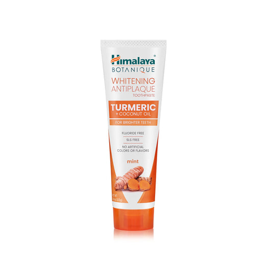 A tube of Himalaya Whitening Antiplaque Turmeric + Coconut Oil Toothpaste features packaging with turmeric roots, mint leaves, and Neem cleanse, highlighting its fluoride-free and SLS-free formula without artificial colors or flavors.