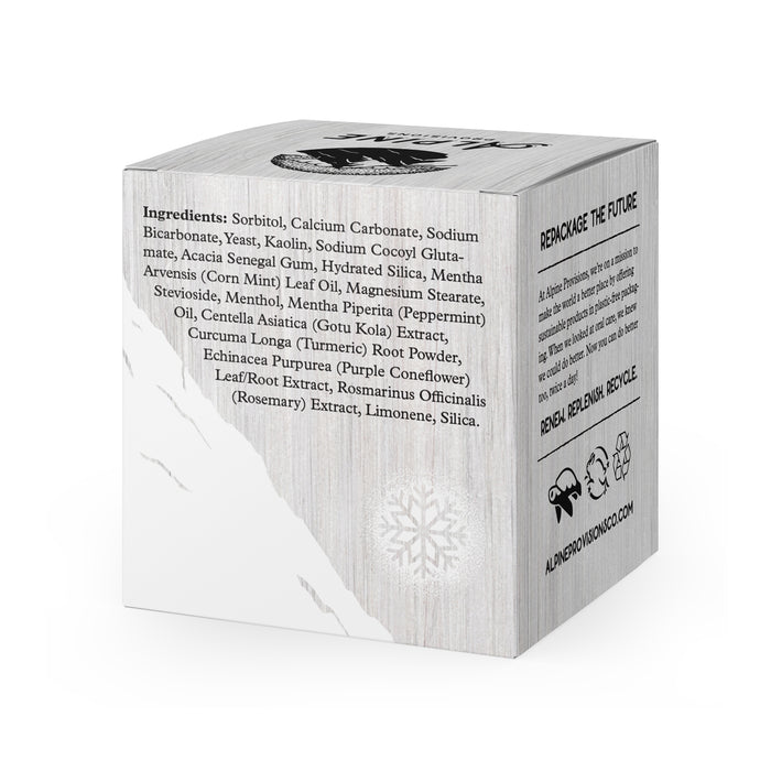 Alpine Provisions Whitening Mint Toothpaste Tabs come in a square box listing sorbitol, peppermint oil, and rosemary extract. It features snowflake and recycling symbols on a wood-textured background, highlighting healthy teeth and gums. REPACKAGE THE FUTURE is printed at the top.