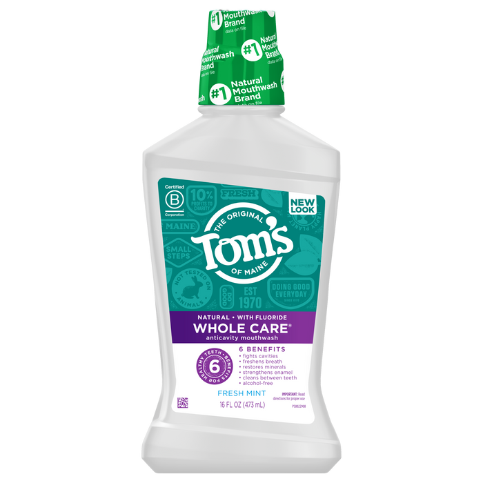 Toms of Maine Whole Care Anticavity Mouthwash offers 16 fl oz (473 mL) of alcohol-free freshness, featuring six benefits, fresh mint, and natural ingredients, as highlighted on its purple and white label.