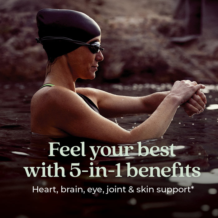 A woman in a swim cap and goggles stands in water adjusting her goggles. Text over the image reads: “Support heart, brain, eye, joint & skin health* with Wholemega™ Fish Oil from New Chapter—wild Alaskan salmon oil rich in Omega-3.”.