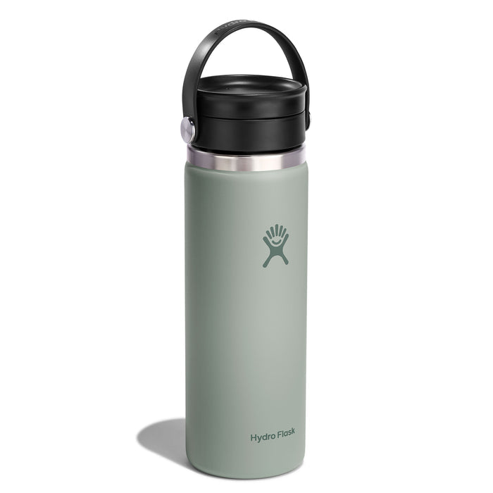The Hydro Flask Wide Mouth Bottle, designed for coffee and tea, is an insulated 20 oz stainless steel bottle in light green. It features TempShield double-wall insulation, a black Flex Sip Lid with a carrying handle, and showcases a white logo with a stylized figure near the bottom.