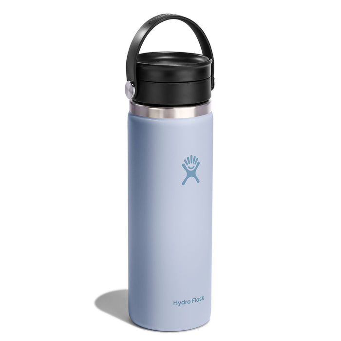 A light blue 20 oz Hydro Flask Wide Mouth Bottle with a black Flex Sip Lid™, handle, and TempShield insulation. The stylized logo of a person with outstretched arms decorates the bottle, while Hydro Flask is at the base, guaranteeing its leakproof and ideal for coffee or tea.