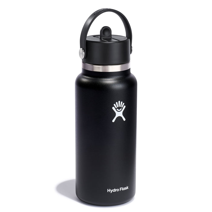 A sleek black 32 oz Hydro Flask Wide Mouth Bottle features an abstract hand logo, a handle, a leakproof straw cap for convenience, and the brands name printed elegantly at the bottom.