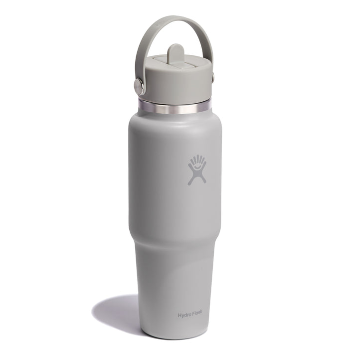 A gray 32 oz Hydro Flask Wide Mouth Travel Bottle features an insulated design with a Flex Straw Cap, handle, secure lid, simple logo, and the Hydro Flask name at the bottom. It has a sleek, ergonomic shape and matte finish.