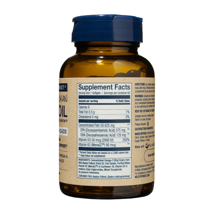 Wileys Finest Wild Alaskan Fish Oil, with Omega-3, K2 & D3, comes in a brown bottle with a blue cap displaying the supplement facts label, detailing its EPA, DHA content along with vitamins. The text is small and slightly blurred.