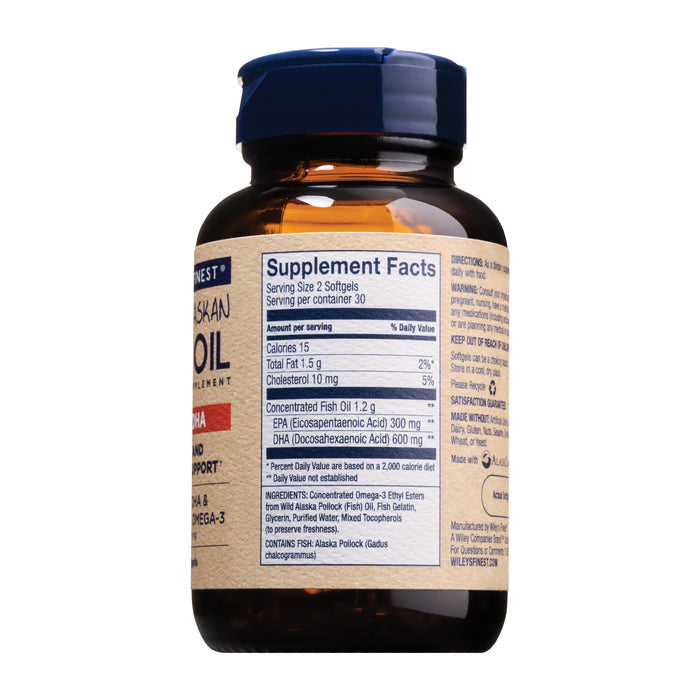 A brown bottle of Wileys Finest Wild Alaskan Fish Oil - Peak DHA has a blue cap and details supplement facts like calories, cholesterol, and omega-3 content, including DHA and EPA per serving.
