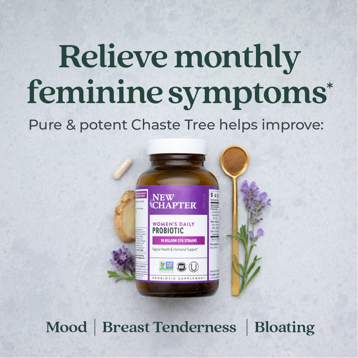 A bottle of Women's Daily Probiotic with a label highlighting Chaste Tree for feminine symptoms. Surrounding it are a probiotic capsule, spoon of powder, branch of lavender, and a slice of ginger. Text mentions mood, breast tenderness, and bloating.