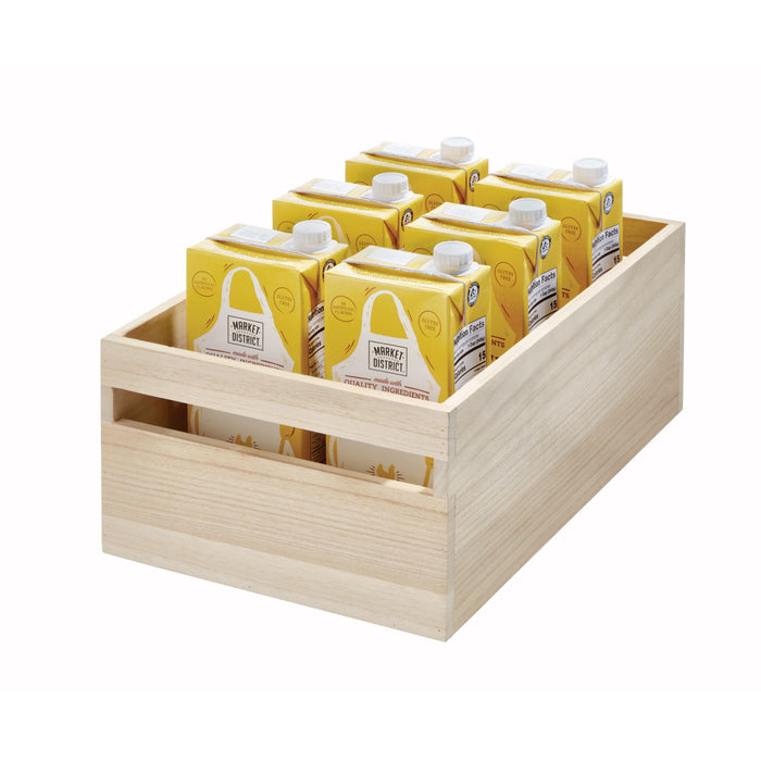The iDesign Wood Handled Bin neatly cradles eight yellow nut milk cartons, lined in two rows. Each carton features a white cap with branding and text, while the bin is crafted from renewable Paulownia wood.