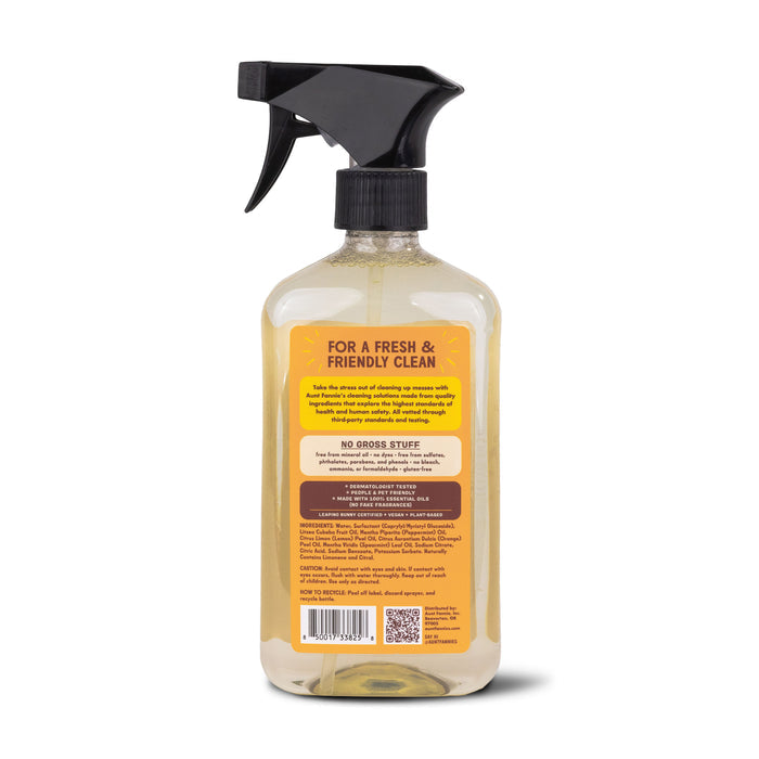 Aunt Fannies Wood Surface Cleaner boasts a black nozzle and a golden solution with essential oils. The label promises a fresh clean without harsh chemicals, using plant-based surfactants for a spotless shine on wood surfaces.