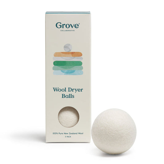 A box labeled Grove Co. Wool Dryer Balls sits beside a white wool ball, adorned with pastel laundry icons, emphasizing its eco-friendly and hypoallergenic features. Made from 100% pure New Zealand wool, it comes in a 3-pack.