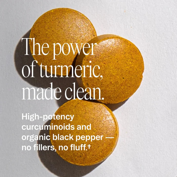 Three Ora Organic Turmeric Curcumin Tablets on a white surface, featuring high-potency curcuminoids, joint comfort support, organic black pepper, and no fillers or fluff.