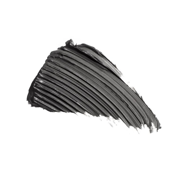 The elegant brushstroke of glossy black on a white background, with its texture and diagonal lines, captures the essence of IZZY Zero Waste Beautys cruelty-free Zero Waste Mascara.
