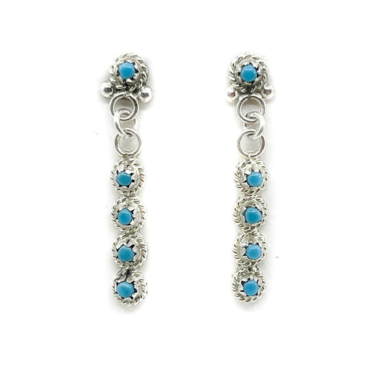 Handcrafted Zuni Petit Point Turquoise Earrings
Earrings measure approximately&nbsp;1.25 inches&nbsp;long&nbsp;x 0.18 inches wide

Sterling Silver&nbsp;posts and backs